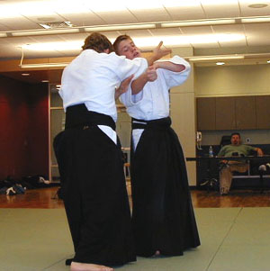 Goss Sensei performing irimi nage on DJ